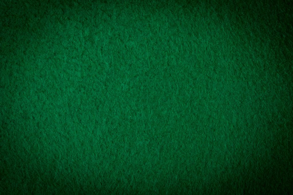 37294284 green poker table textured soft material background D&C Amusement Company, Inc.